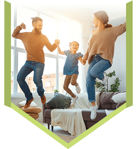 Happy, jumping young family thanks to FHC's Family Practice services