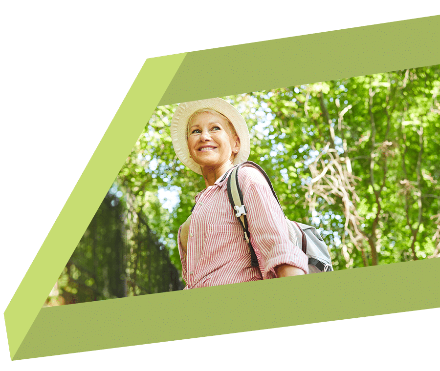 Mature woman excited to be out hiking in nature