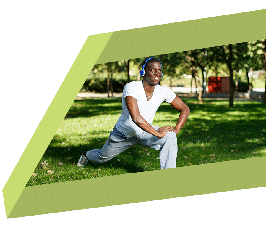 Middle age man staying active and stretching before workout