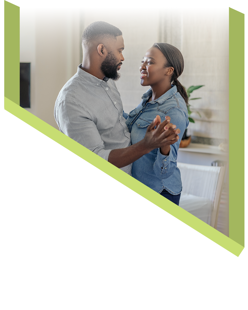 Couple happy and dancing together, pleased with Hormone treatment services from FHC